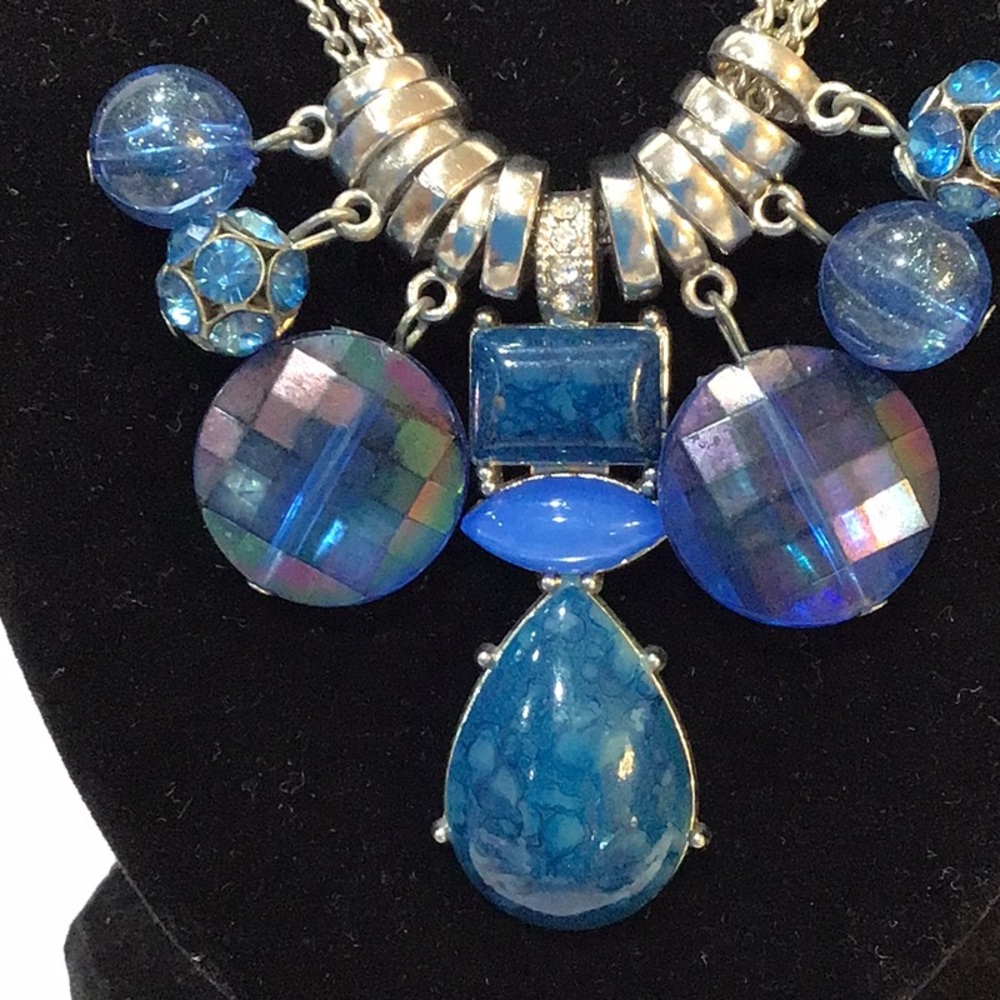 Blue charm necklace on triple silvertone chain